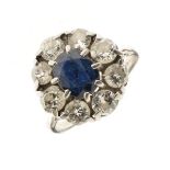 Sapphire and diamond nine stone cluster ring, the white mount with Continental marks, the oval cut