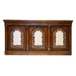 Mid 19th Century rosewood side cabinet, the rectangular top over three frieze drawers with carved