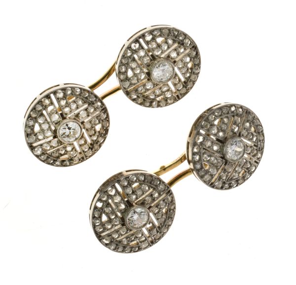 Pair of diamond set cufflinks, set in white metal with yellow connectors stamped '750', the circular