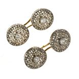 Pair of diamond set cufflinks, set in white metal with yellow connectors stamped '750', the circular