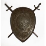 19th Century cast iron shield in the manner of Elkington, relief-decorated with a battle scene