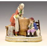 20th Century Continental porcelain figure group of a washerwoman with child, entitled in gilt to