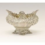 Victorian silver basket, having embossed floral decoration with splayed pierced rim standing on four