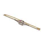 French diamond and calibré ruby bar brooch, the central old brilliant cut of approximately 0.08