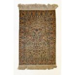 Middle Eastern silk Hereke rug, the biscuit-coloured field with mihrab or prayer niche filled with
