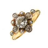 Diamond and seed pearl cluster 18ct gold ring, the central brilliant cut of approximately 0.37