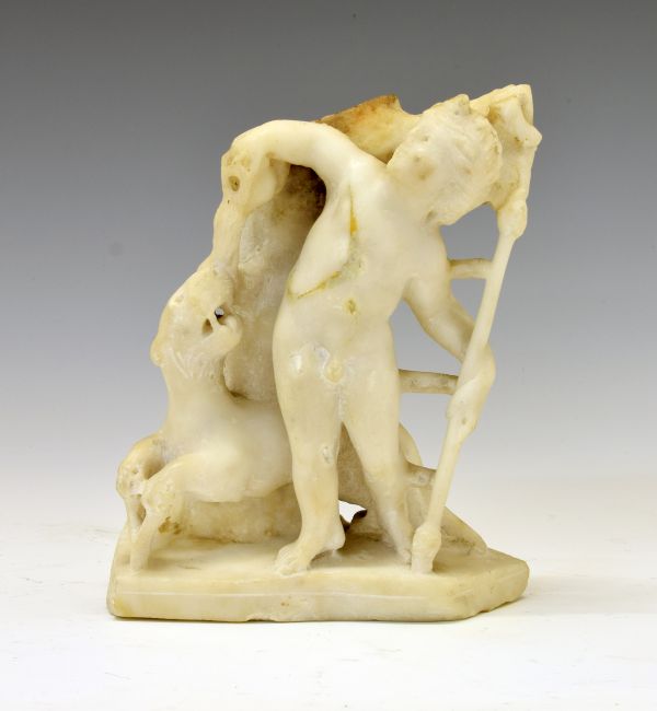 Antiquities - Carved white marble figure of Eros, modelled in standing pose holding a staff in his