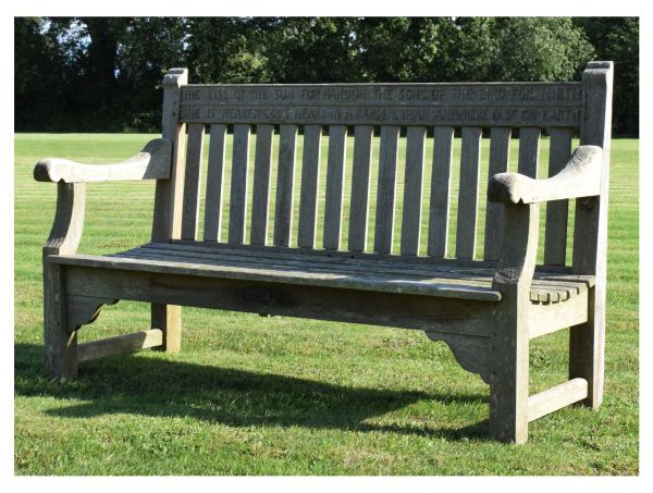 Mid 20th Century weathered teak garden bench, the back rail carved with verses from 'God's Garden'