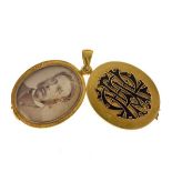 Victorian gold locket, with applied black enamel monogram, swing open action, containing a