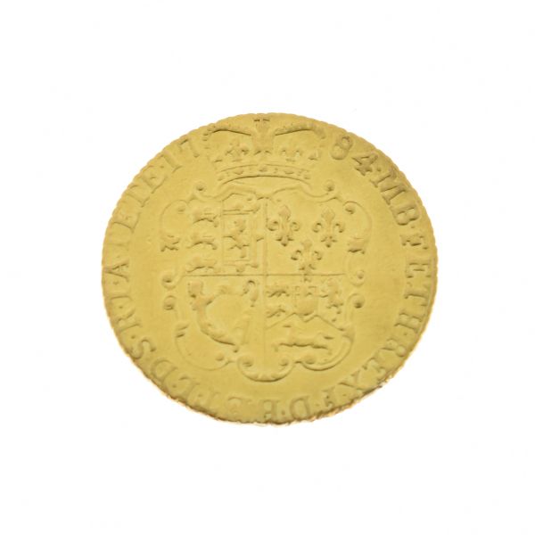 Gold Coin, - George III crowned guinea 1784 Condition: Surface wear and scratching, sign of ex-mount