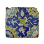 16th/17th Century Persian Safavid cuerda seca pottery tile, of square form decorated with a stork or