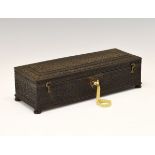 Indian carved ebony glove box, the hinged cover having floral and foliate decoration on four