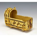 Rare late 17th/early 18th Century English buff slipware rocking cradle or crib, in the manner of