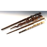 Ethnographica - Two African carved hardwood tribal staffs, the smaller carved with figures and