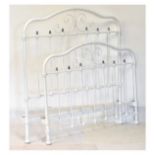 White-painted metal bed of tubular design with scroll decoration, 125cm wide x 13cm high, with