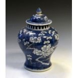 Late 19th/early 20th Century Chinese porcelain baluster jar and cover decorated with prunus blossom,