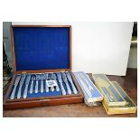 Early 20th Century mahogany-cased fish cutlery for twelve settings, together with three boxes of