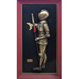 Framed relief depicting a Medieval knight in suit of armour labelled Greenwich 1515, approximately