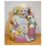 Modern Chinese porcelain figure of Hotei or Budai seated with five children