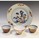 Two Chinese porcelain tea bowls, each having a café-au-lait exterior and internal underglaze blue