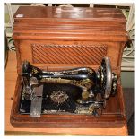 Cased Singer sewing machine J338071