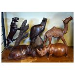 Group of five carved wooden animals to include; camel, hippopotamus and rhino, tallest 32cm high (5)