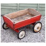 Vintage child's pullalong trolley having painted wooden body and metal wheels