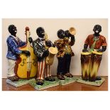 Four ceramic figurines modelled as jazz musicians, largest 33cm high