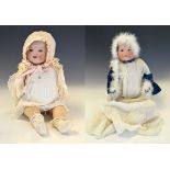 Two early 20th Century Armand Marseille bisque headed dolls, smaller one marked 351/4, measures