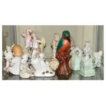 Group of porcelain figurines to include; spill holders, bisque figurines, etc