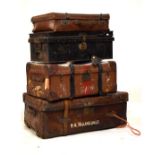 Large vintage leather trunk, a canvas covered suitcase, one other suitcase and a metal document