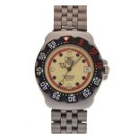 Tag Heuer - Stainless steel mid-size 'Formula 1' wristwatch, pale yellow dial with dot hour