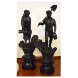 Pair of early 20th Century spelter figures, modelled as male and female workers on turned ebonised