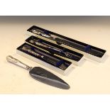 Four silver handled serving items, butter spreader, pickle fork, bread knife and cake slice