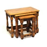 Nest of three oak rectangular topped occasional tables, 62cm wide