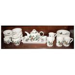 Portmeirion pottery wares to include; teapot, four mugs, milk jug and sugar, tray, bowls etc, all