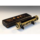 Early 20th Century Burmese black lacquered pen tray of cylindrical cradle form marked beneath Burma,