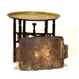 Benares style brass tray and folding wooden stand, 58cm diameter, and a silver plated rectangular