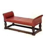 Early 20th Century beech framed low window seat upholstered in studded red hide, 90cm wide