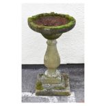 Composite stone bird bath on baluster column and square plinth, 73cm high