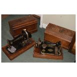 Two early 20th Century walnut-cased sewing machines