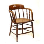 Late 19th/early 20th Century oak bow arm chair having cane seat