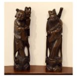 Pair of early 20th Century Japanese carved rootwood figures, 29.5cm high