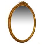 20th Century oval bevelled glass gilt framed mirror, 72cm high