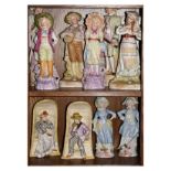 Group of early 20th Century Continental bisque figures to include an unusual pair of a lady and