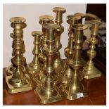 Five pairs of assorted brass candlesticks