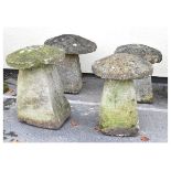 Four staddle stones, one having composite stone pedestal