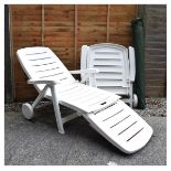 Garden parasol and pair of folding plastic sun loungers