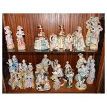 Large group of assorted ceramic figurines to include; Continental bisque pairs, etc