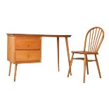 Mid 20th Century beech and Formica topped desk, together with a beech and elm seat Windsor back